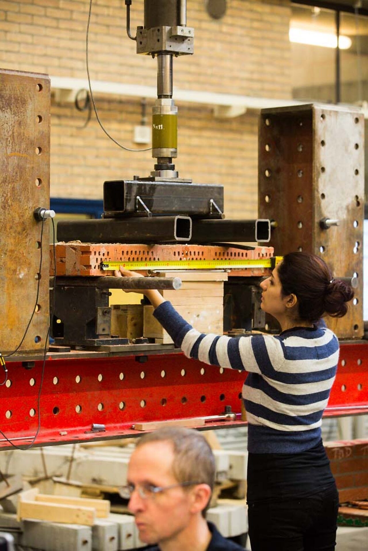Women measuring the machine