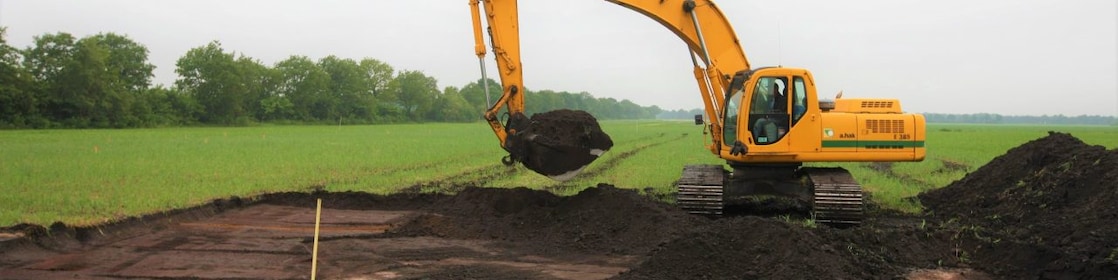 Graafmachine in het weiland
